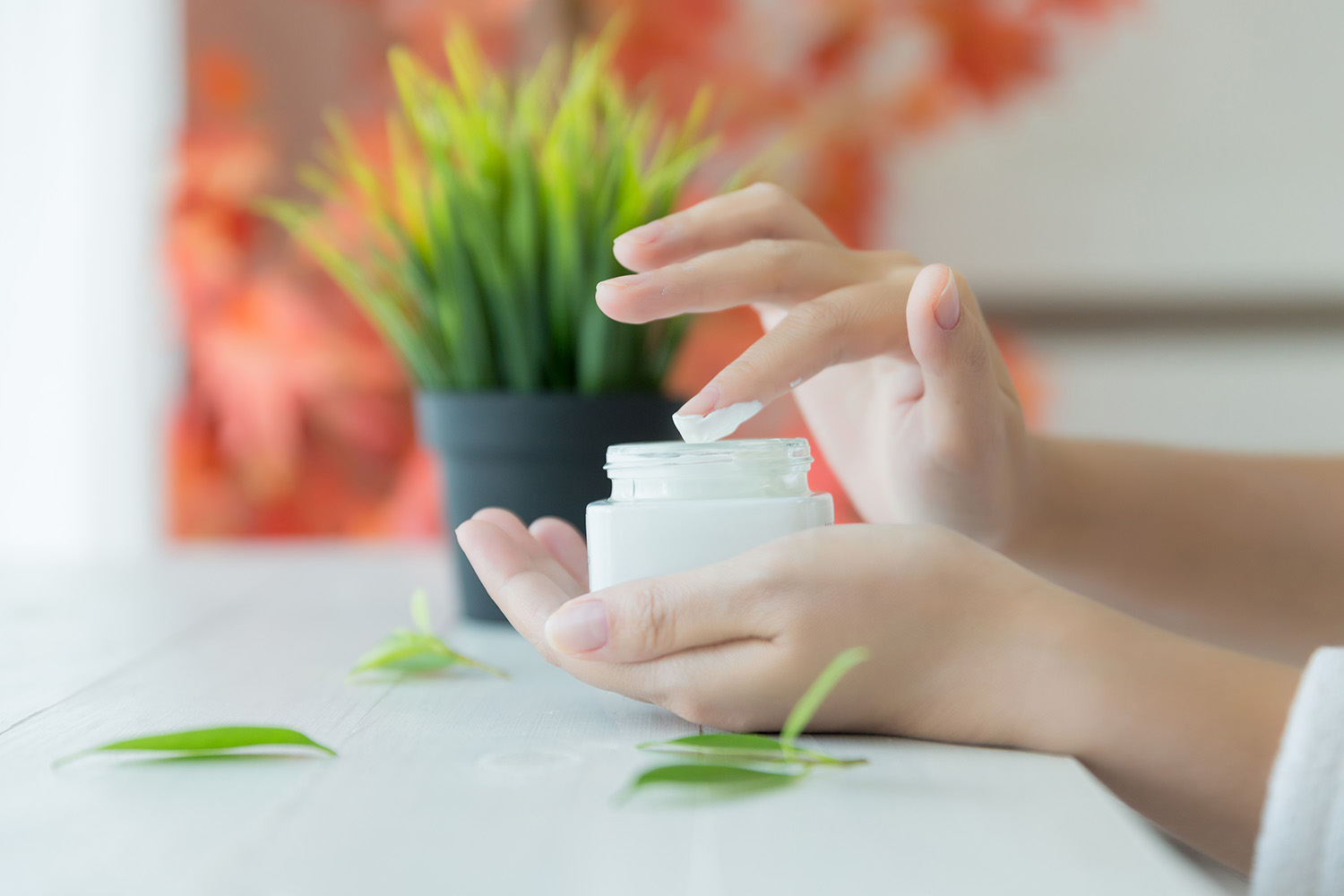 woman holds a jar with a cosmetic cream in her hands. skin care